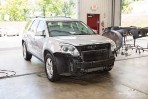 Car with damage before repair